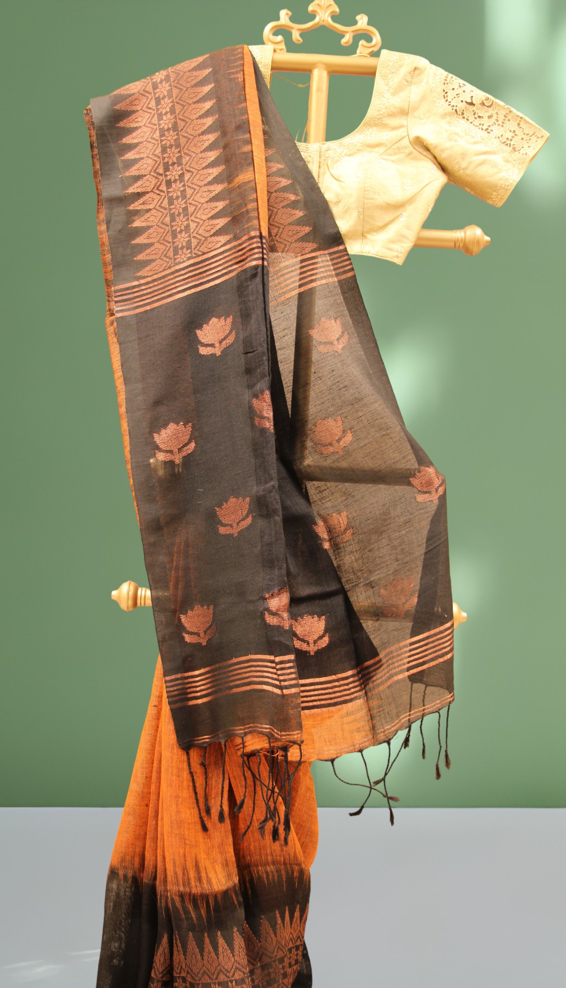Rust black handwoven Lenin saree with lotus design pallu