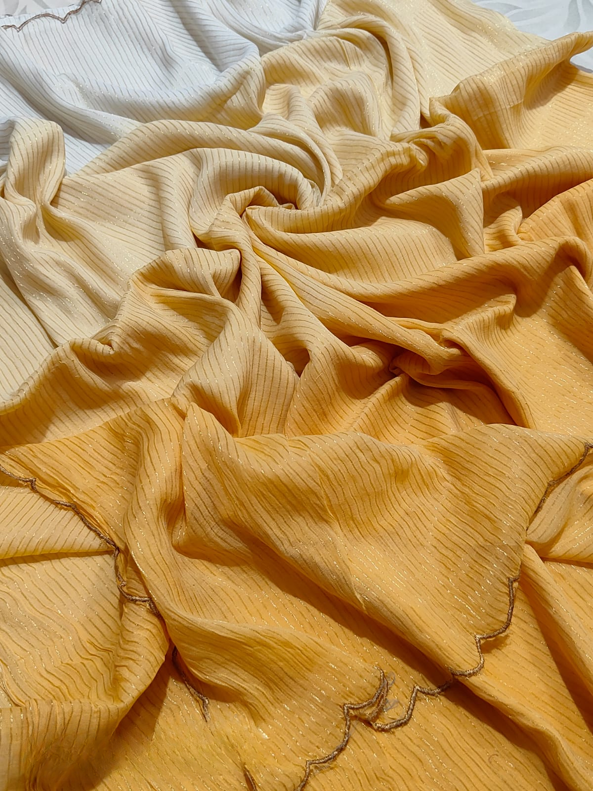 Mul cotton saree with zari stripes and scalloped edges